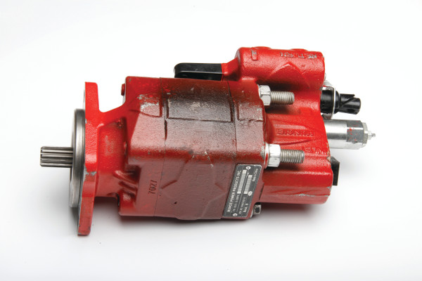 An image of a red dump pump that has a discoloration in the middle of the pump from it being burnt during use.